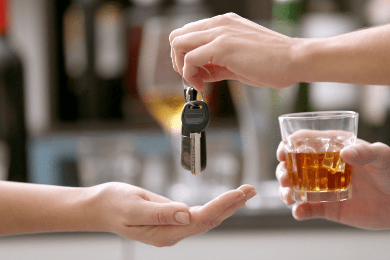 Responsible drinker hands car keys to a friend